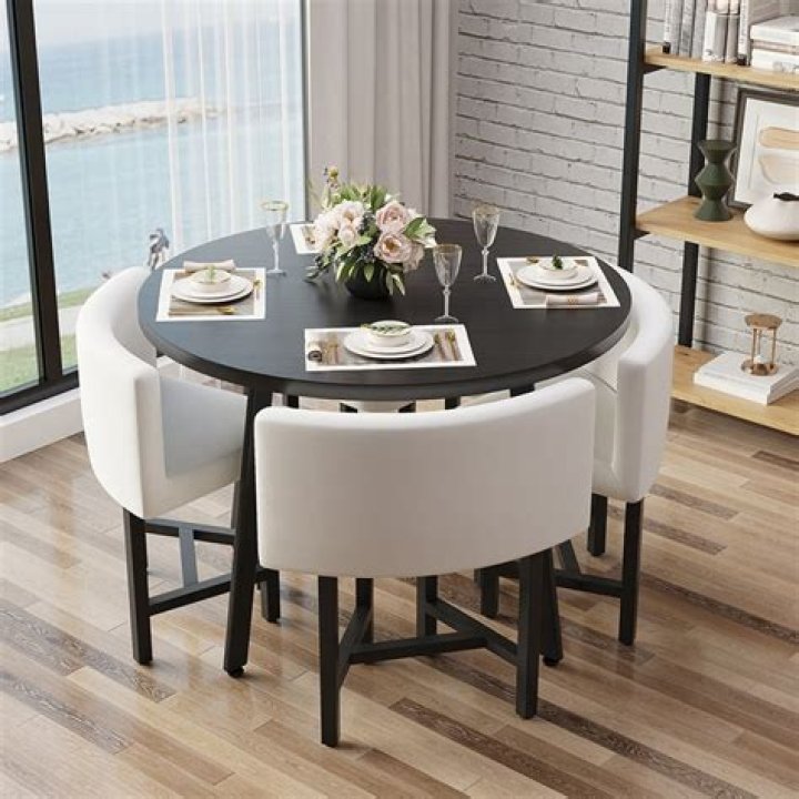 a table with chairs and a table with objects on it