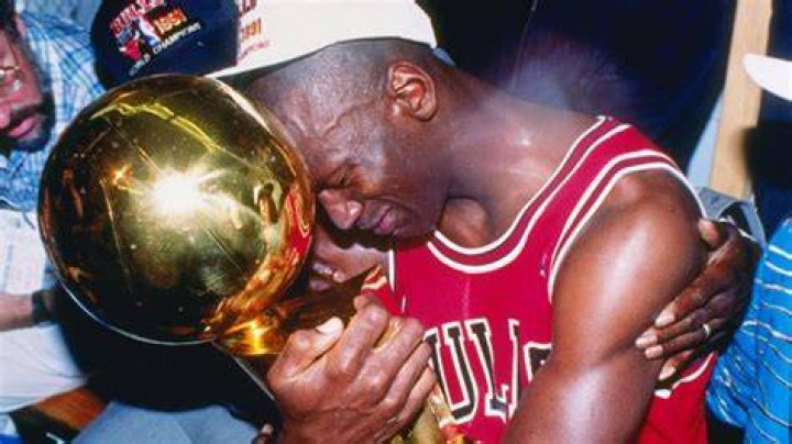 Michael Jordan holding the first Bull's Championship Trophy in 1991